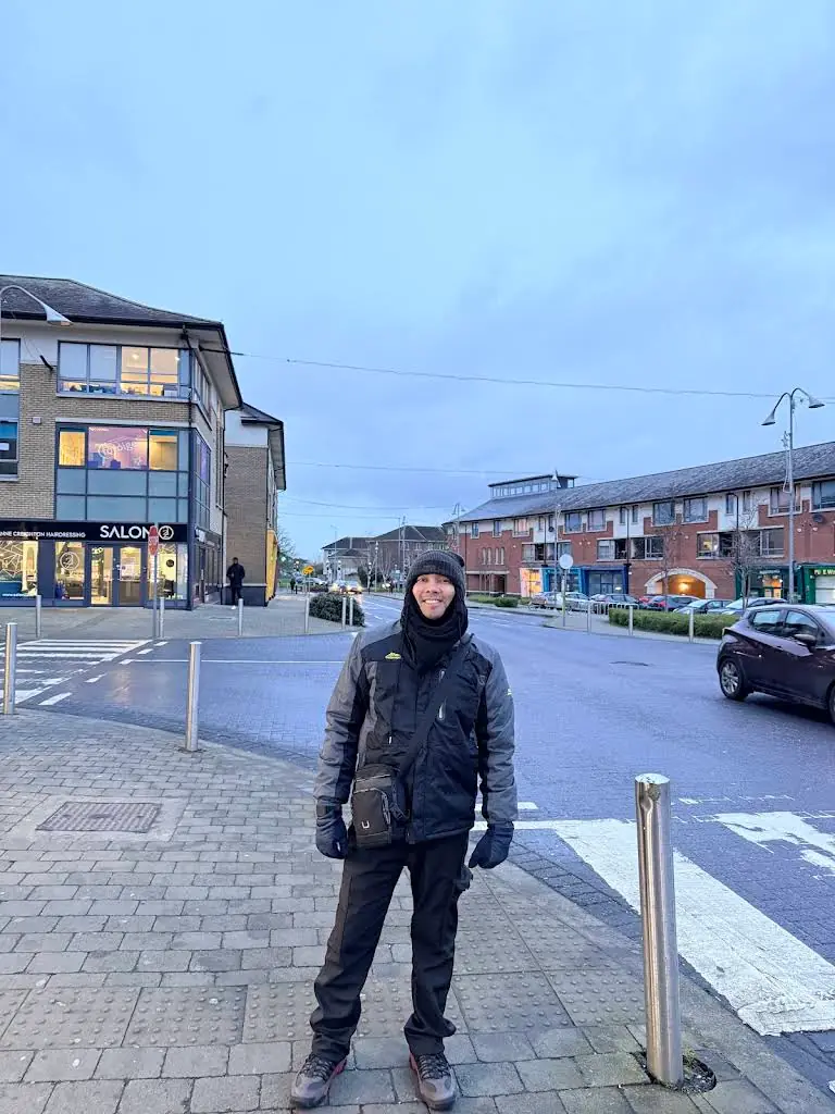 Man in a winter jacket on a town street